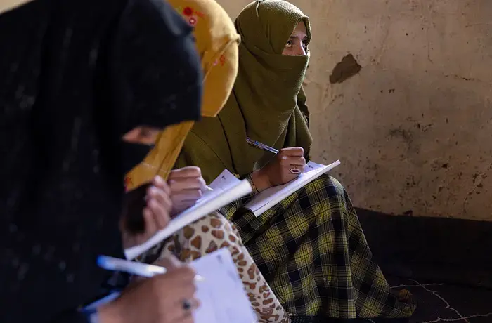 Women learn to read and write through a literacy initiative supported by UN Women, in Nuristan province, eastern Afghanistan. As part of the initiative, 130 Village Literacy Committees were also established. By improving their literacy, the women can also strengthen their livelihoods, access to healthcare and build their resilience, in one of the most isolated and underserved provinces in Afghanistan. Photo: UN Women/Sayed Habib Bidell