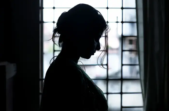 profile view of woman in window frame